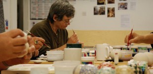 Marion decorating a bowl at Edinburgh Ceramic Studio. Photography: Artists Own